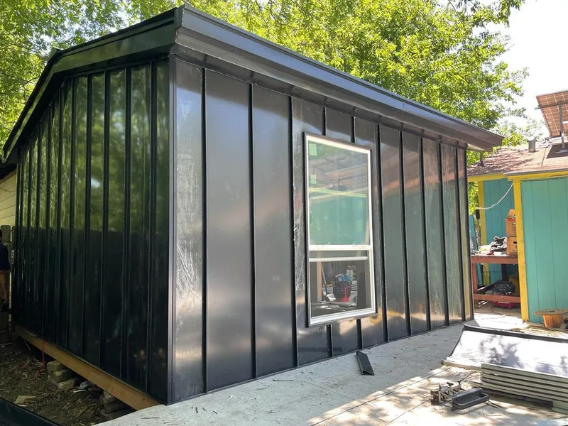 Black standing seam metal wall panels for Metal Roof Installation in Ruston